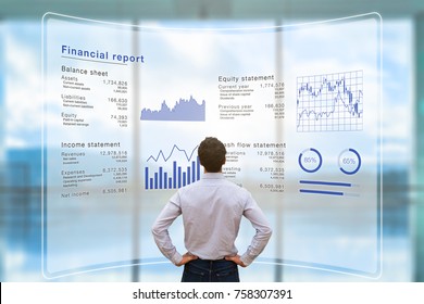 Businessman analyzing financial report data of the company operations (balance sheet, income statement) on virtual computer screen with business charts, fintech