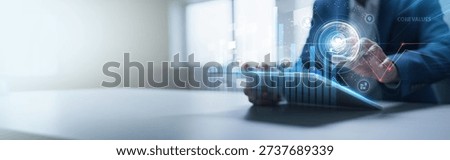 Businessman analyzing structured graph charts and tablet data of corporate ethics, core values, leadership principles, teamwork culture, brand identity, and business integrity.