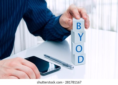 Businessman arranging small blocks with word 