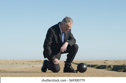Businessman Attached To Ball And Chain - Shutterstock ID 369300779