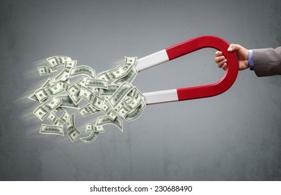 Businessman Attracting Money With A Horseshoe Magnet Concept For Business Success, Strategy Or Greed