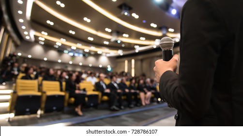 The Businessman In The Auditorium.