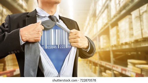 businessman with barcode reader in warehouse, logistics