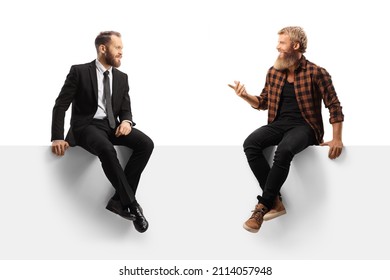 Businessman And A Bearded Casual Guy Sitting On A Panel And Having A Conversation Isolated On White Background