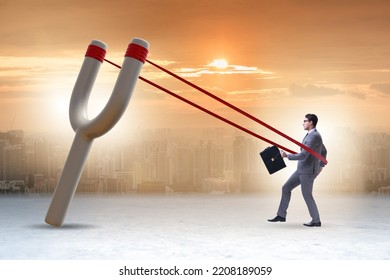 Businessman Being Launched From Slingshot In Career Concept