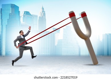 Businessman Being Launched From Slingshot In Career Concept