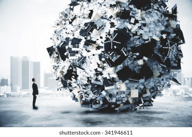 Businessman and big heap of office stuff at city background
