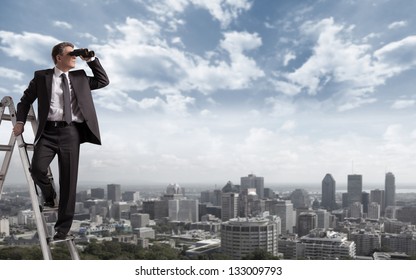 Businessman with binoculars spying on competitors. - Powered by Shutterstock