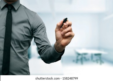 businessman with black marker in the hand at the office