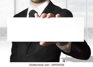 Businessman In Black Suit Holding Sign Empty