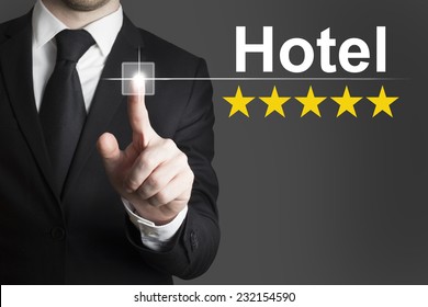 Businessman In Black Suit Pushing Button Hotel Golden Star Rating