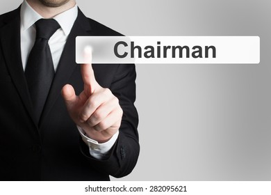 Businessman In Black Suit Pushing Button Chairman