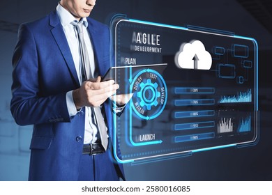 A businessman in a blue suit interacts with a futuristic holographic interface for agile development, featuring cloud and system data on a dark background