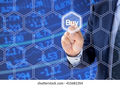 Businessman In A Blue Suit Pressing The Buy Button An A Hexagon Grid N Front Of A Stock Ticker Wall