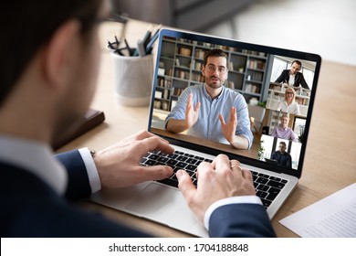 Businessman boss leader leads distant communication diverse businesspeople involved in group videocall conversation discuss common project, partners negotiating. Modern technology and business concept - Shutterstock ID 1704188848