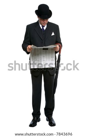 Businessman in bowler hat and three piece pinstripe suit reading a financial newspaper.