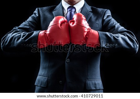 Businessman , boxing gloves , fighting pose