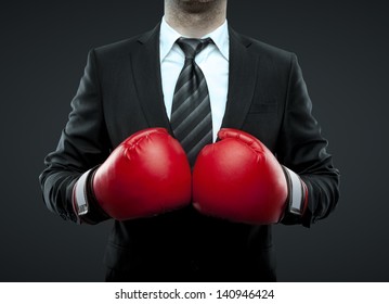 businessman in boxing gloves isolated on black - Powered by Shutterstock