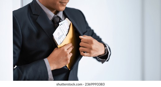 Businessman briefcase document envelope with dollar banknotes on white background. businessman putting illegal secret agreement money in his jacket. corruption, bribery, crime and embezzle concept