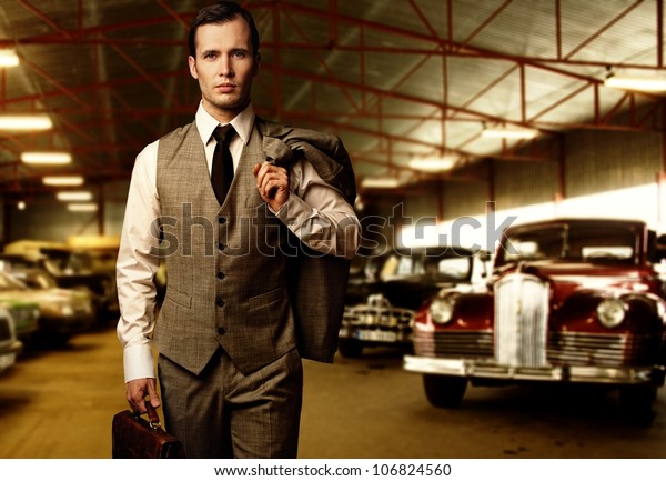 Businessman with a briefcase\
in garage