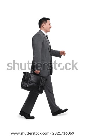 Businessman with briefcase walking on white background