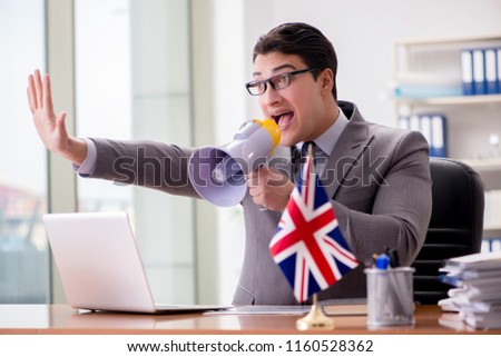 Businessman with British flag in the office