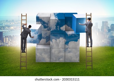 Businessman Building Cloud Cube With Shapes