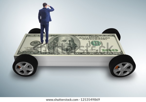 Businessman in\
the business concept with dollar\
car