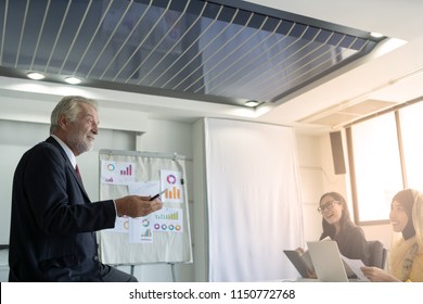 Businessman At Business Conference Meeting. He Was Smiling And He Is A Boss Who Will Lead Town Hall Meeting.