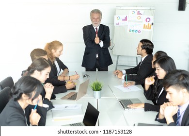 Businessman At Business Conference Meeting. He Was Smiling And He Is A Boss Who Will Lead Town Hall Meeting.