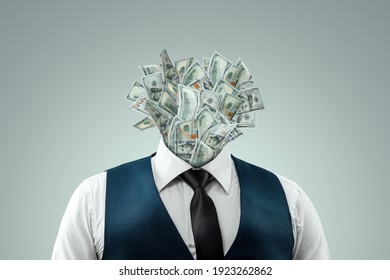 A businessman in a business suit with banknotes instead of a head, a head made of dollars. The concept of money addiction, working only for money, business, startup, career