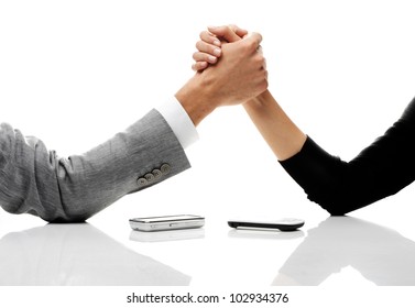 businessman and businesswoman arm wrestling on table.