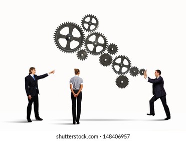 Businessman And Businesswoman With Cog Wheel Elements. Organization Concept