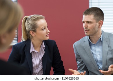 Businessman And Businesswoman In Mediation Meeting