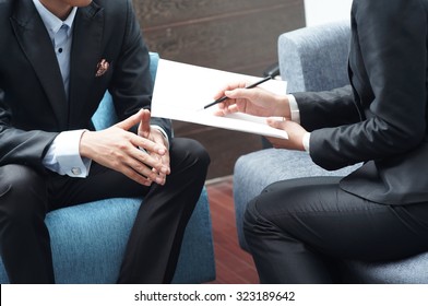 Businessman And Businesswoman Meeting On Sales Pitch