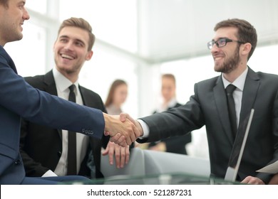 Businessman By Handshake Invites To Cooperation.