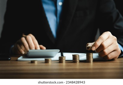 Businessman calculates investment income, financial business investments analyze risks, research companies, consult experts, plan wisely for financial goals. insurance companies, mutual funds, stocks