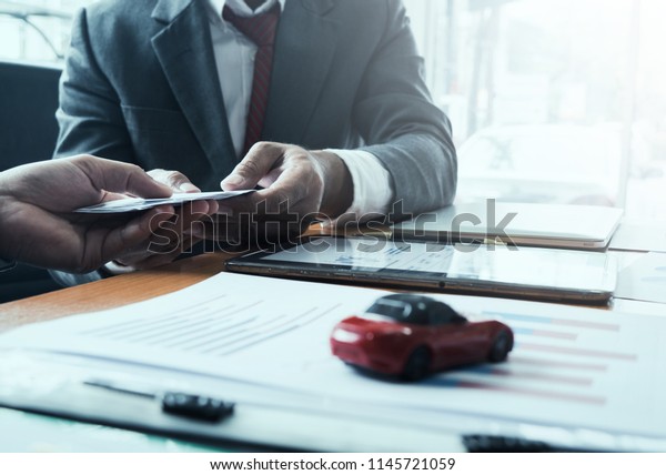 Businessman and car dealer make
agreement to buy a new car with short-term credit. Without
deposit