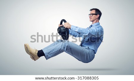 Businessman car driver in glasses and tie with a wheel