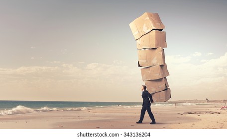 Businessman carrying big stack of carton boxes - Shutterstock ID 343136204