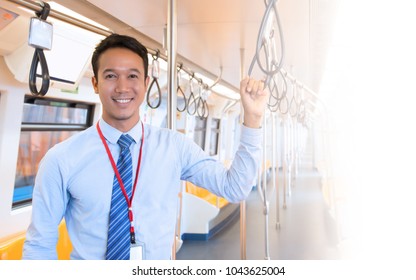 Businessman Catch Handrail On Skytrain Transit System Public 
Impassioned To Going To Work In The Morning, Urban Live Concept