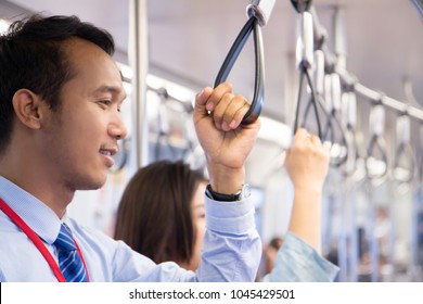 Businessman Catch Handrail On Skytrain Transit System Public 
Impassioned To Going To Work In The Morning, Urban Live Concept