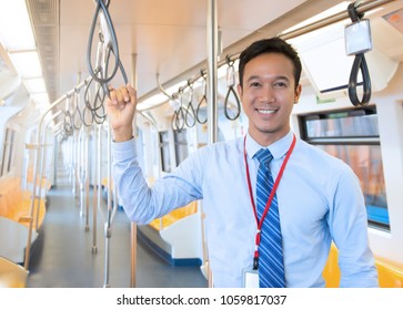 Businessman Catch Handrail On Skytrain Transit System Public 
Impassioned To Going To Work In The Morning, Urban Live Concept