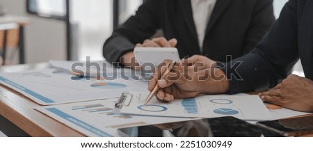 Businessman and Certified Public Accountant (CPA) auditor providing accounting and auditing services in the same company and stock market chart data and anti bribery of accounting