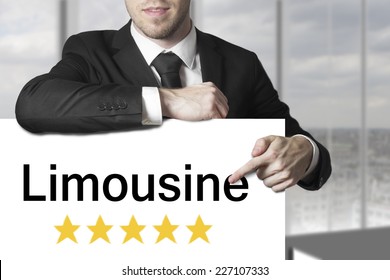 Businessman Chauffeur In Black Suit Pointing On Sign Limousine Five Stars