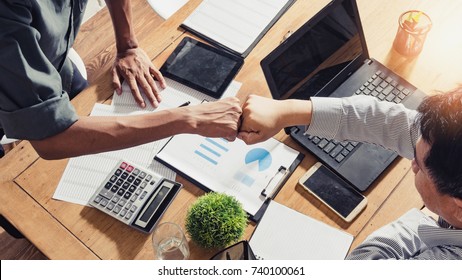 Businessman a check data lots of number together teamwork, concept of teamwork of the businessman, Fist bump,Teamwork coordinated well understood and successful.