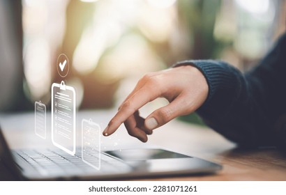Businessman check and check mark online ,Business Agreements and Approvals ,Confirmation of contract documents or warranty card ,Approval of checklist documents ,management or quality assurance - Shutterstock ID 2281071261