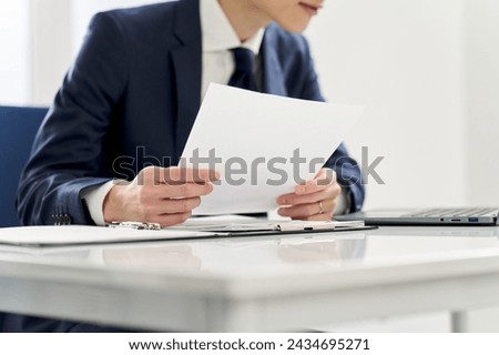 Businessman checking the contents of documents
