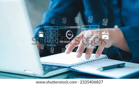 Businessman checking data transfer using laptop computer with data server storage icon for data exchange and transfer concept.