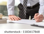 Businessman checking a document in office